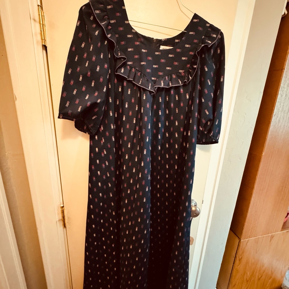 Black Ruffle-Yoke Maxi Dress with Subtle Red Print